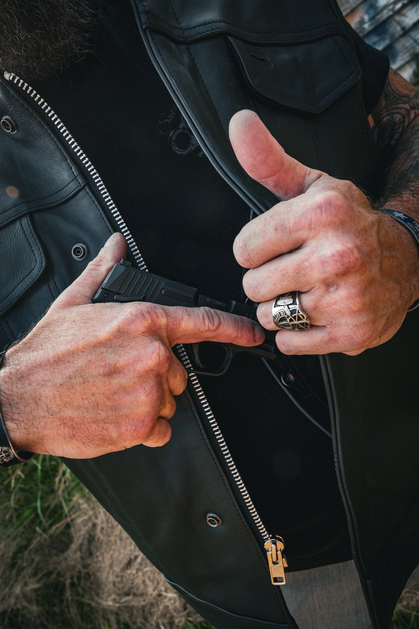 . Featuring cowhide leather construction, a classic black color, four exterior pockets, two inside concealed carry pockets, zip snap main closure, antique brass hardware, and a focus on comfort