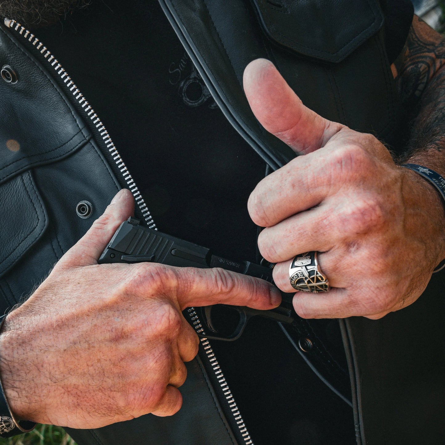 Made from cowhide leather, it includes four exterior pockets, two inside concealed carry pockets, a zip snap main closure, antique brass hardware, and a one-panel back, offering both style and functionality for various settings.