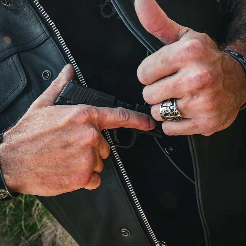 it includes four exterior pockets, one Quick Access concealed carry pocket, One inside conceal carry pocket, a zip snap main closure, YKK hardware, and a one-panel back, offering both style and functionality for various settings.