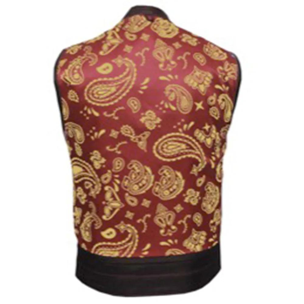 Made from cowhide leather with a red and gold paisley lining, it includes four exterior pockets, two inside concealed carry pockets, a zip snap main closure, antique brass hardware, and a one-panel back, providing versatility and functionality for various settings.