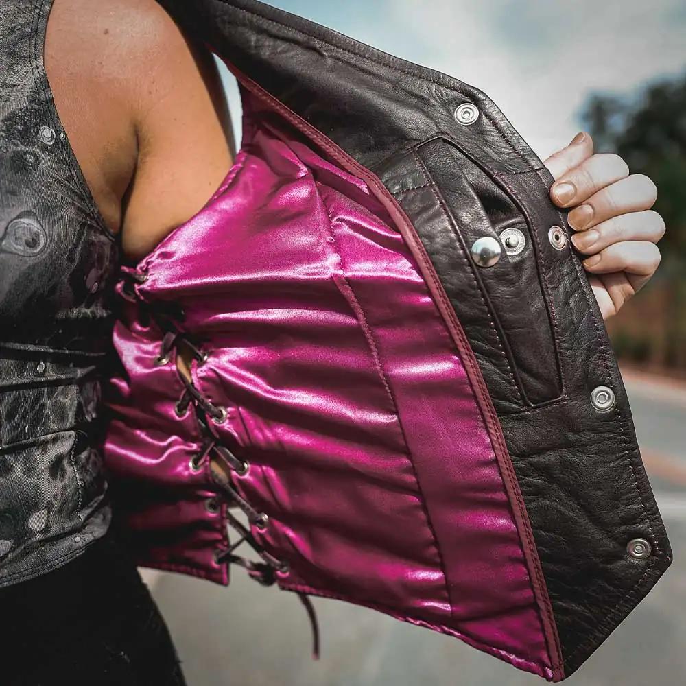 Style # 6897.17 epitomizes timeless elegance and functionality with a ladies' premium traditional vest crafted from luxurious lambskin leather