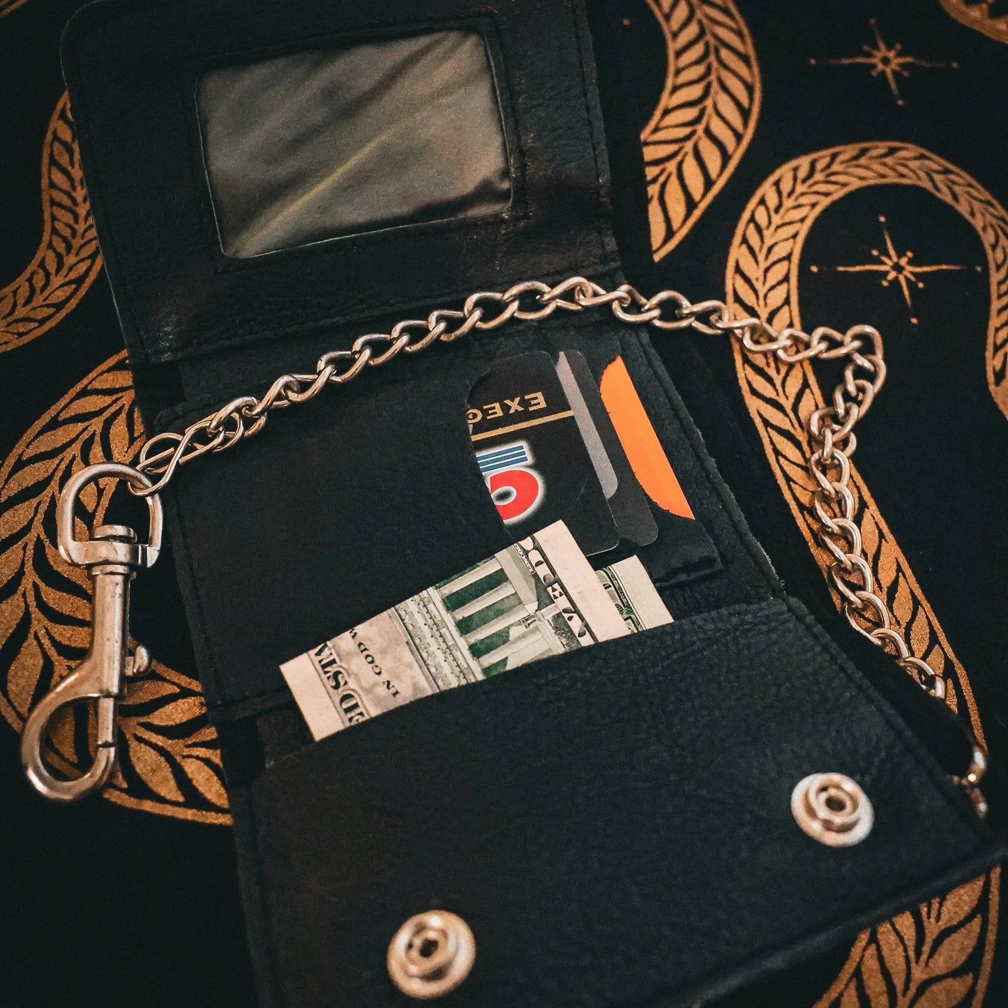 Made from premium leather for durability and a stylish appearance.
Chain attachment for security and an edgy biker look.