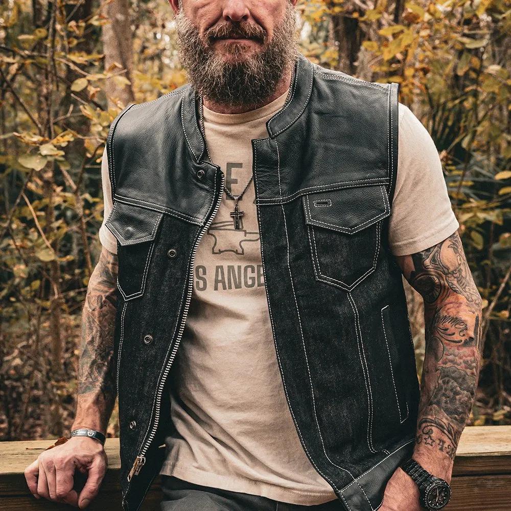 Man wearing a black leather vest over a beige t-shirt lifestyle image
