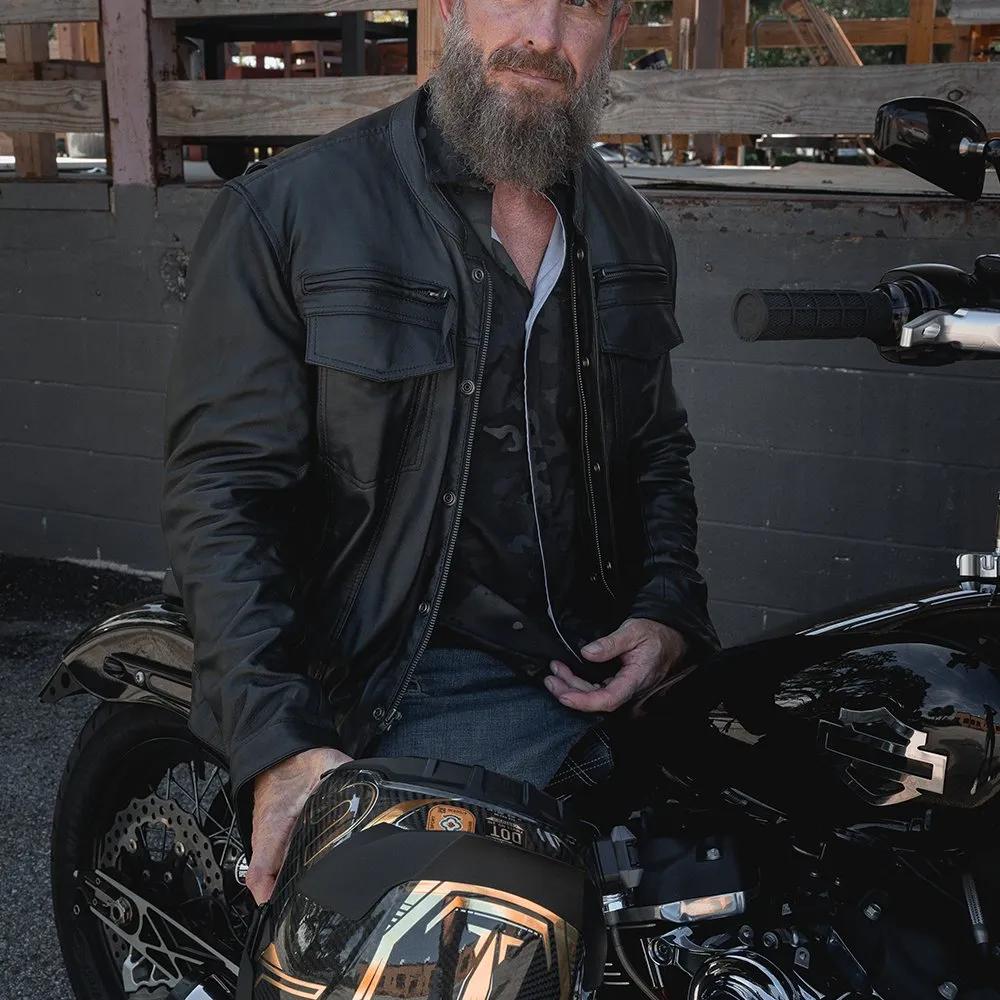 Man with a beard in leather jacket on motorcycle lifestyle image