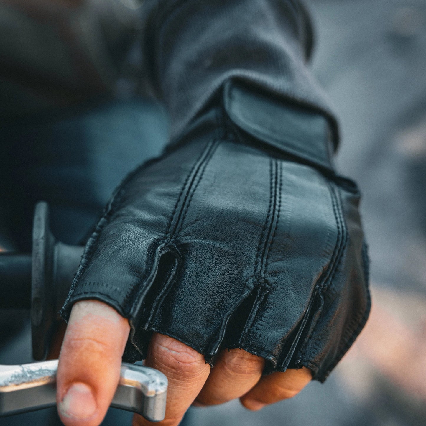 Men's Premium Cowhide Leather Fingerless Gloves combine durability with comfort and style. Crafted from supple cowhide leather, they offer protection while maintaining dexterity.