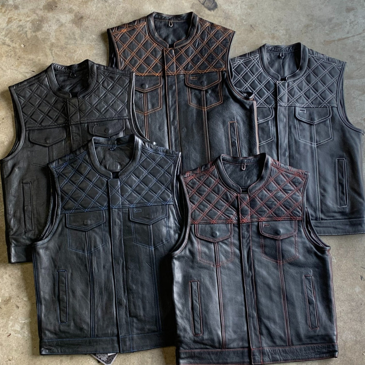 Made from cowhide leather with a diamond stitch pattern, it includes four exterior pockets, two inside concealed carry pockets, a zip snap main closure.