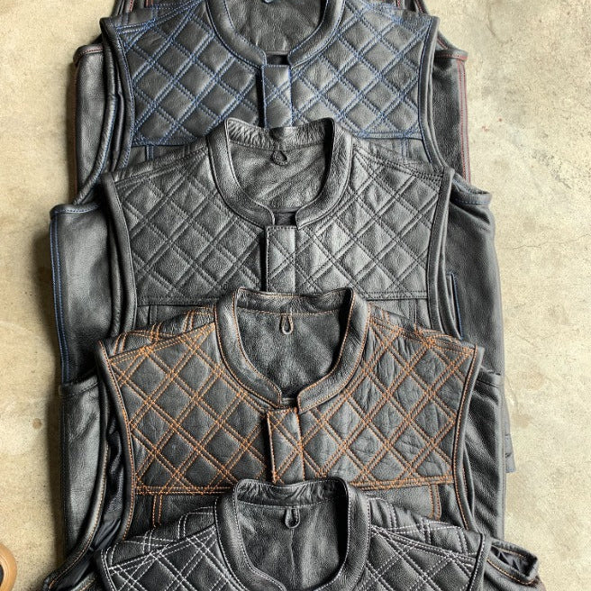Made from cowhide leather with a diamond stitch pattern, it includes four exterior pockets, two inside concealed carry pockets.