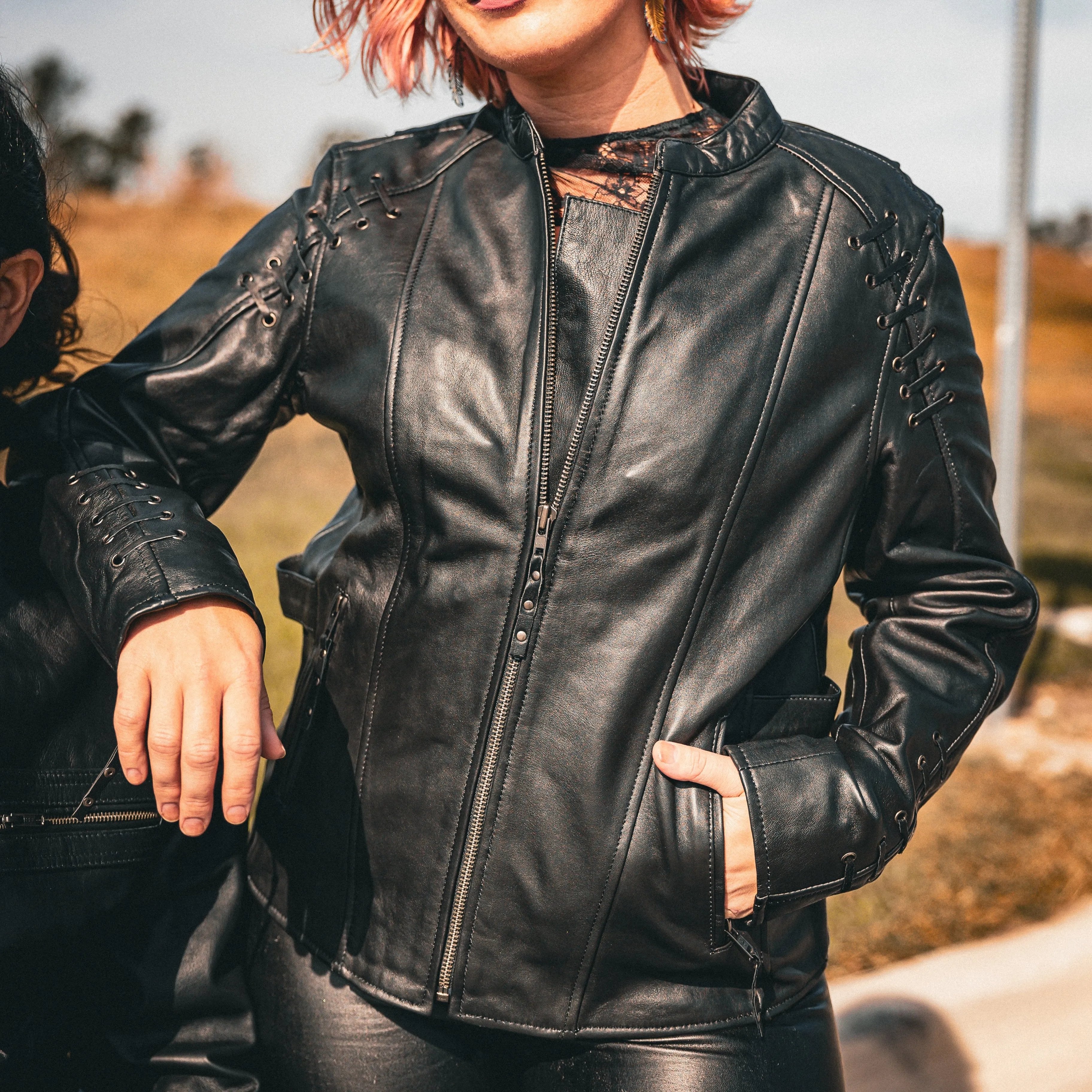 . Crafted from luxurious lambskin leather in classic black, this jacket combines modern design elements with timeless style, making it an essential piece for your wardrobe