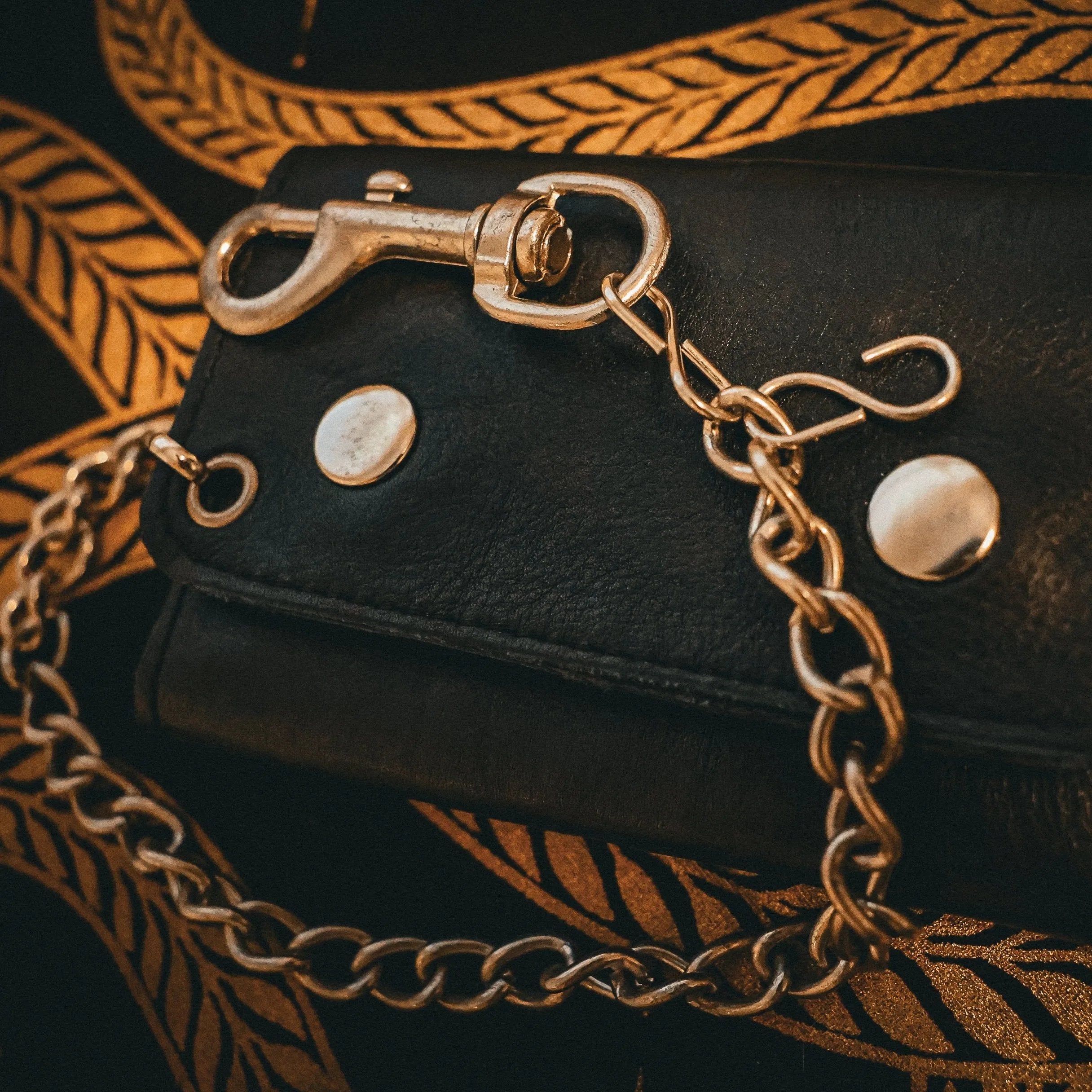 Made from premium leather for durability and a stylish appearance.
Chain attachment for security and an edgy biker look.