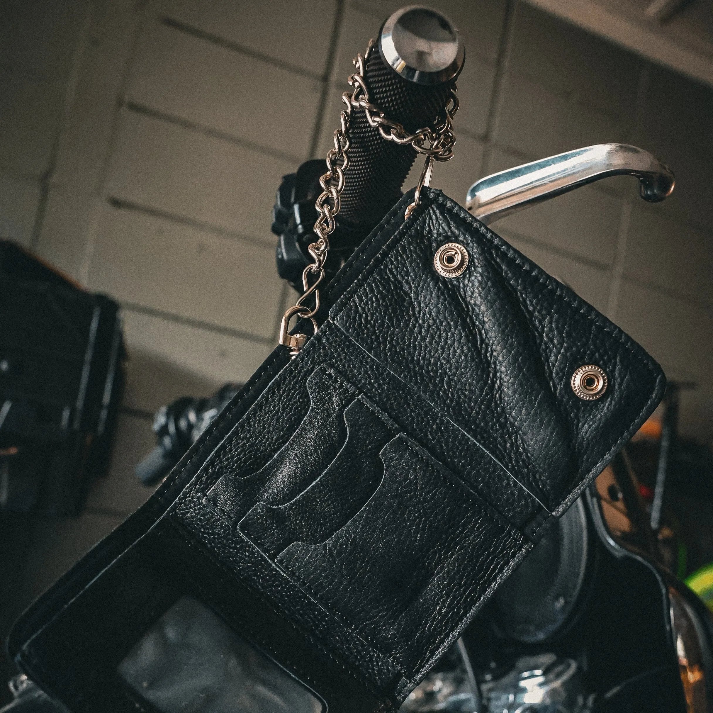 Made from premium leather for durability and a stylish appearance.
Chain attachment for security and an edgy biker look.