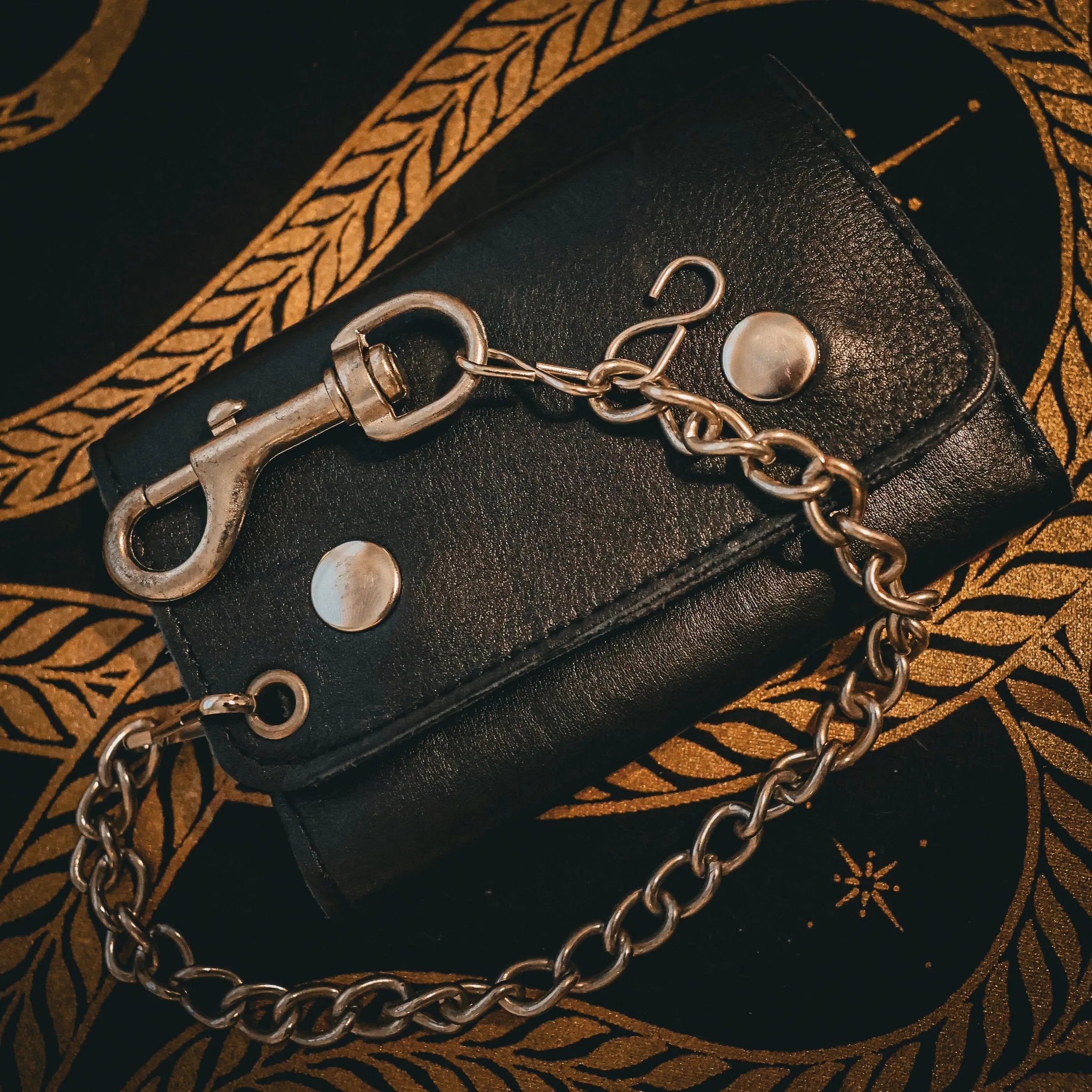 Made from premium leather for durability and a stylish appearance.
Chain attachment for security and an edgy biker look.