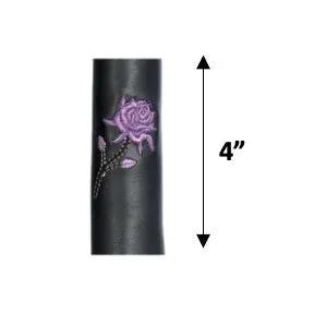 Black cylindrical object with a purple rose  