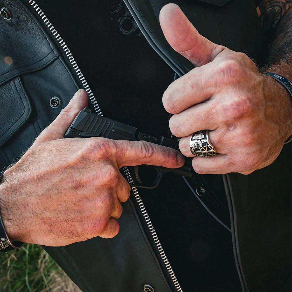 The Men's Ultra SOA Style Club Vest by Unik Ultra blends iconic design with practical features. Made from cowhide leather, it includes four exterior pockets, two inside concealed carry pockets, a zip snap main closure, antique brass hardware