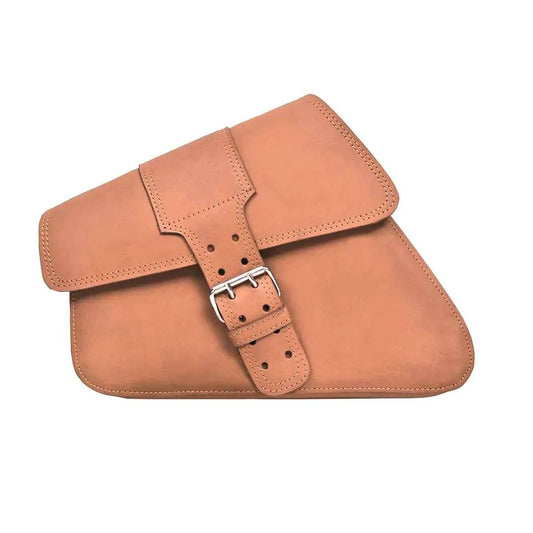 Tan leather satchel with a buckle starp