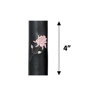 leather cylindrical product with a pink floral design 